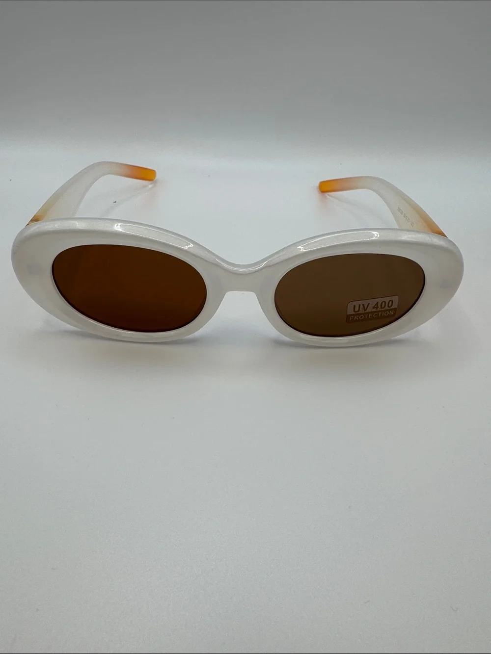 White Oval Sunglasses with Brown Lenses
